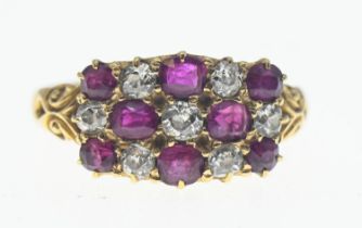 Ruby and diamond cluster ring featuring old cut stones. Comprising of 8 rubies and seven diamonds. S