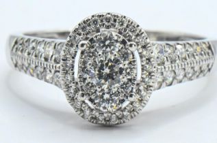 18ct white gold and diamond oval cluster ring, size R, gross weight 3.9 grams