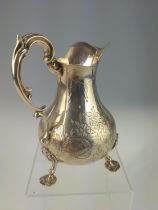 Victorian silver cream jug, Daniel & Charles Houle, London 1865, with floral and scroll decoration,