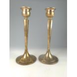 Pair of silver candlesticks, Bert Gordon, Birmingham 1955, each with a tapering octagonal stem and c