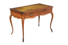 A VICTORIAN OAK AND LEATHER INSET WRITING TABLE