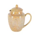 A RUSKIN POTTERY YELLOW LUSTRE LOW-FIRED MILK JUG AND COVER