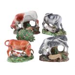 FOUR VARIOUS STAFFORDSHIRE PEARLWARE 'BULL-BAITING' GROUPS