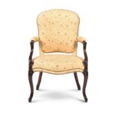 A GEORGE III MAHOGANY OPEN ARMCHAIR, IN THE MANNER OF GEORGE HEPPLEWHITE