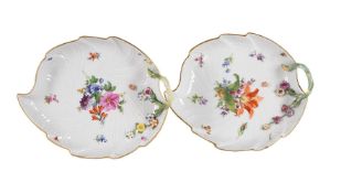 A PAIR OF MEISSEN FLOWER ENCRUSTED LEAF-SHAPED SERVING DISHES
