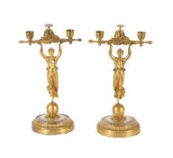 Y A PAIR OF GILT METAL FIGURAL CANDLESTICKS