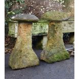 A PAIR OF WEATHERED IRONSTONE STADDLE STONES