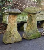 A PAIR OF WEATHERED IRONSTONE STADDLE STONES