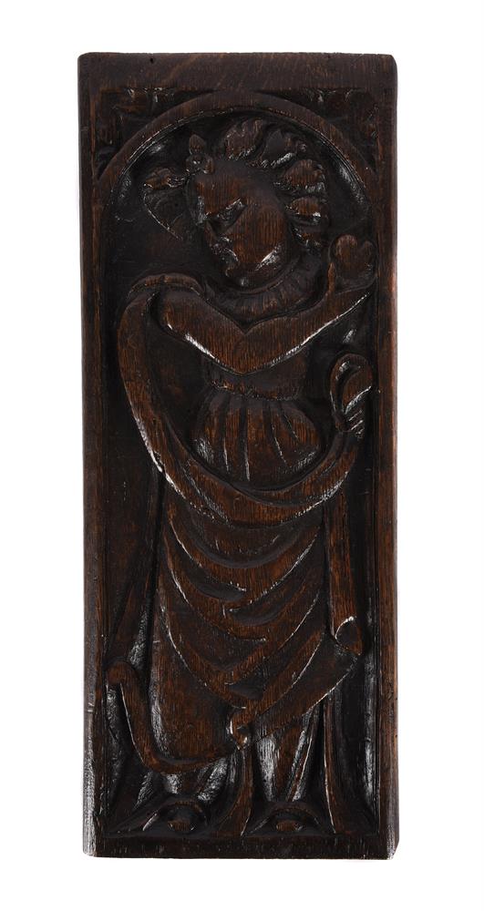 A CARVED OAK PANEL