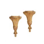 A PAIR OF CARVED GILTWOOD WALL BRACKETS IN GEORGE III STYLE