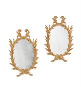 A PAIR OF CARVED GILTWOOD WALL MIRRORS IN GEORGE III STYLE