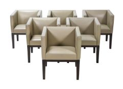 A SET OF SIX EBONISED AND LEATHER UPHOLSTERED ARMCHAIRS