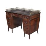 AN EDWARDIAN MAHOGANY AND SATINWOOD CROSSBANDED DESK, ATTRIBUTED TO JAMES SHOOLBRED & CO.