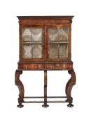 A WALNUT CABINET ON STAND, EARLY 18TH CENTURY AND LATER