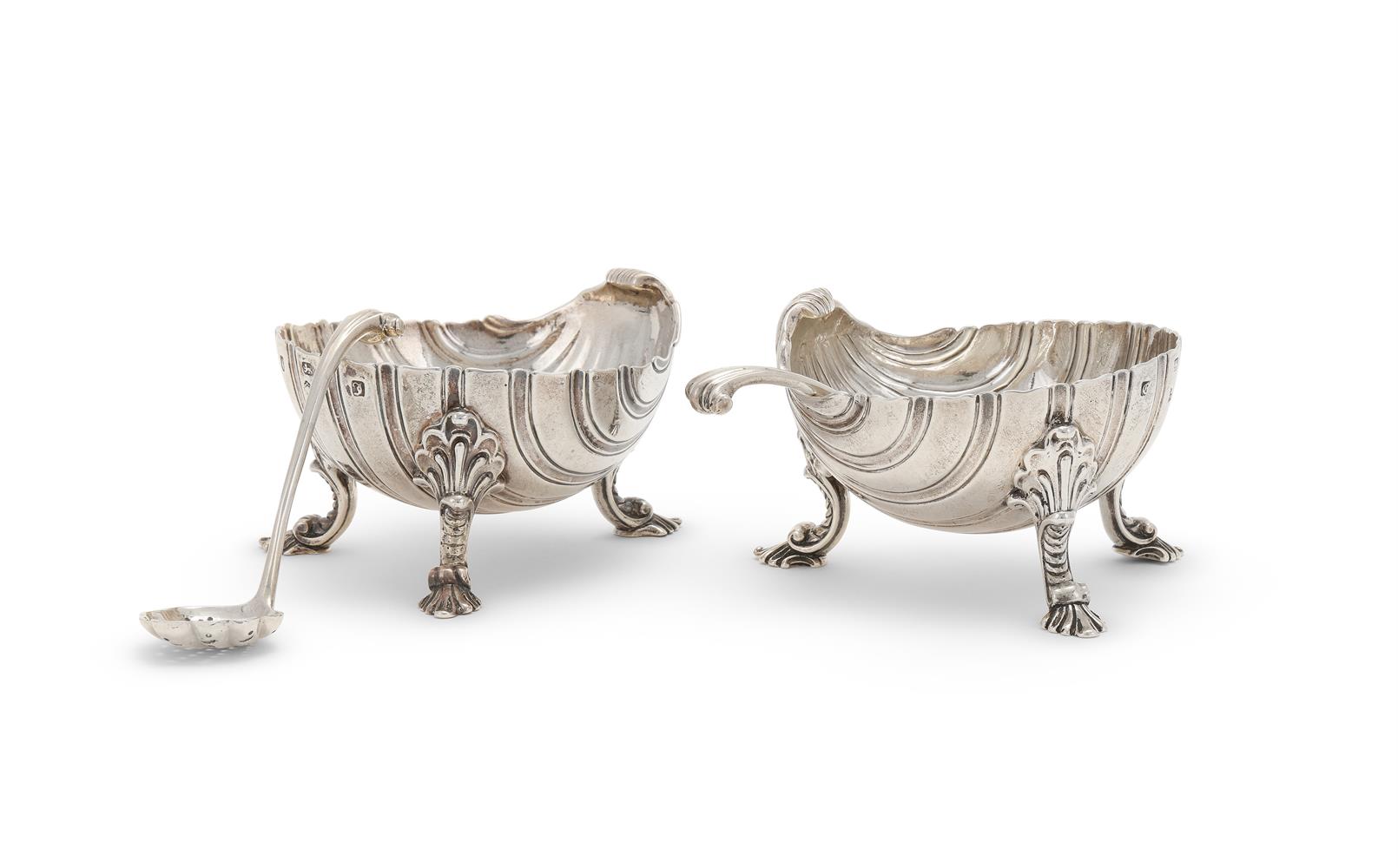 A MATCHED PAIR OF GEORGE III SILVER SHELL SHAPED SALTS EDWARD WAKELIN, LONDON 1760 AND 1764