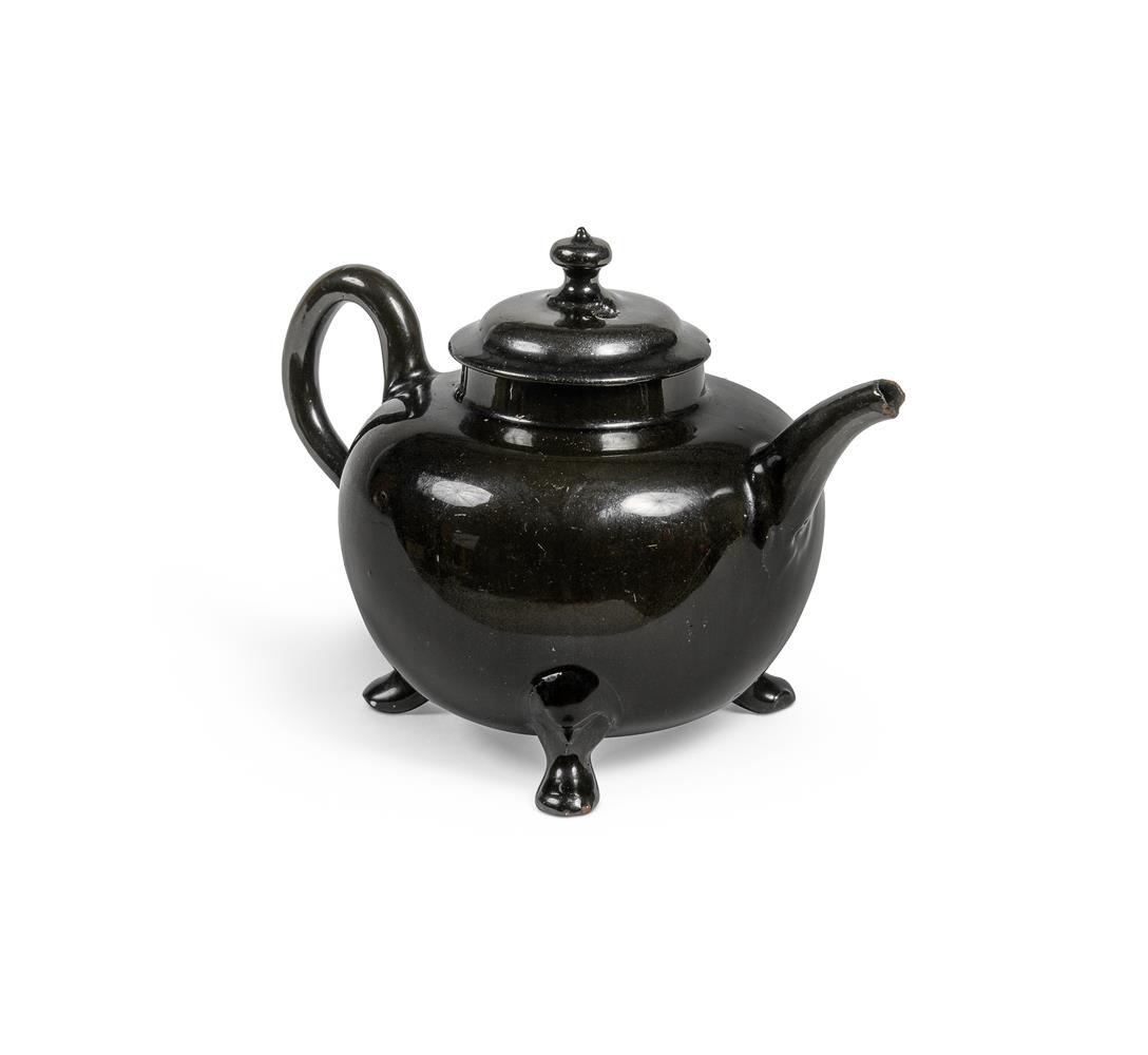 AN ENGLISH BLACK-GLAZED RED POTTERY TEAPOT AND COVER OF JACKFIELD POTTERY TYPE MID 18TH CENTURY