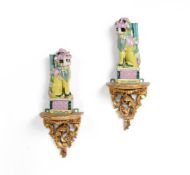 A PAIR OF FAMILLE ROSE JOSS HOLDERS IN THE FORM OF BUDDHIST LIONS, 19TH CENTURY