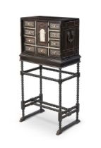 Y AN EBONY AND EBONISED, IVORY MARQUETRY INLAID CABINET ON STAND