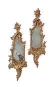 A PAIR OF SMALL CARVED GILTWOOD WALL MIRRORS IN THE GEORGE III STYLE, 19TH CENTURY