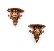 A PAIR OF ITALIAN GILT COMPOSITION AND PLASTER WALL BRACKETS, 19TH CENTURY