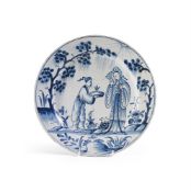 AN ENGLISH DELFT CHINOISERIE DISH EARLY 18TH CENTURY