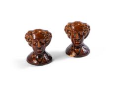 A PAIR OF STAFFORDSHIRE TREACLE-GLAZED SASH WINDOW STOPS MID 19TH CENTURY