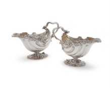 A PAIR OF GEORGIAN SILVER SHELL SHAPED OVAL SAUCE BOATS