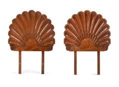 A PAIR OF FRENCH CARVED WALNUT SINGLE HEADBOARDS, IN ART DECO TASTE