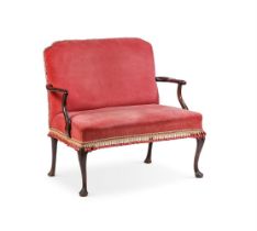 A CARVED MAHOGANY AND VELVET UPHOLSTERED SETTEE IN GEORGE II STYLE, 19TH CENTURY