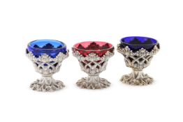 A MATCHED SET OF THREE SILVER PEDESTAL SALTS, HENRY WILKINSON & CO., SHEFFIELD 1836, 1837 AND 1844