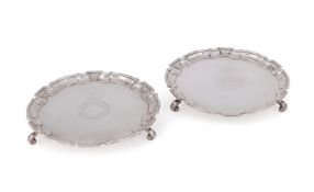 A MATCHED PAIR OF GEORGE II SILVER SHAPED CIRCULAR WAITERS, MAKER'S MARK RF, THE OTHER BY JOHN TUIT