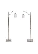 A PAIR OF CHROMED METAL STANDARD LAMPS WITH FROSTED GLASS SHADES, MODERN