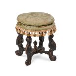 Y A QUEEN ANNE EBONISED AND CARVED BEECH STOOL