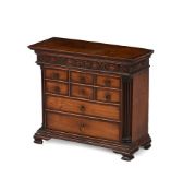 A GEORGE III FRUITWOOD AND YEW CROSSBANDED MINIATURE CHEST OF DRAWERS, CIRCA 1780