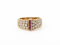 AN 18 CARAT GOLD, RUBY AND DIAMOND BUCKLE RING, LONDON 1989