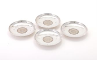 A SET OF FOUR SILVER DISHES