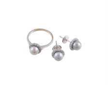 A CULTURED PEARL AND WHITE STONE CLUSTER RING AND EARRINGS