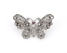 A LATE VICTORIAN AND LATER DIAMOND AND RUBY BUTTERFLY BROOCH