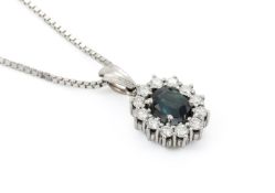 A SAPPHIRE AND DIAMOND CLUSTER PENDANT