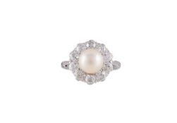 A DIAMOND AND CULTURED PEARL CLUSTER RING