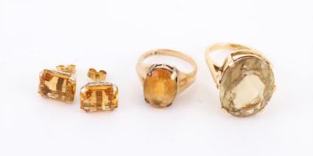 TWO CITRINE DRESS RINGS AND A PAIR OF CITRINE EAR STUDS