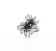 A SAPPHIRE AND DIAMOND CLUSTER DRESS RING