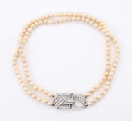 A TWO STRAND CULTURED PEARL NECKLACE WITH A DIAMOND CLASP