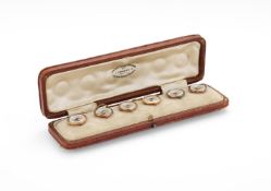 Y AN EARLY 20TH CENTURY SUITE OF SIX SAPPHIRE SET MOTHER OF PEARL BUTTONS