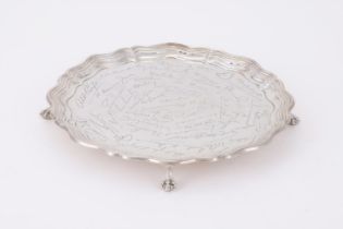 A SILVER SHAPED CIRCULAR SALVER