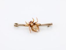 AN EDWARDIAN AND LATER SPIDER BAR BROOCH