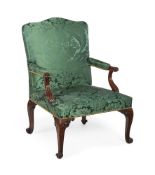 AN EARLY GEORGE III CARVED MAHOGANY ARMCHAIR ATTRIBUTED TO PAUL SAUNDERS