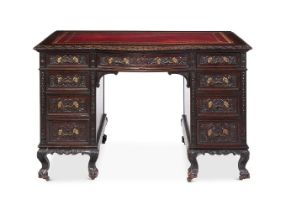 A LATE VICTORIAN CARVED MAHOGANY TWIN PEDESTAL DESK CIRCA 1890