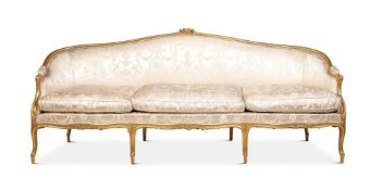 A LOUIS XV CARVED GILTWOOD AND UPHOLSTERED CANAPE CIRCA 1770 AND LATER