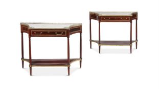 A PAIR OF DIRECTOIRE MAHOGANY, ORMOLU MOUNTED AND MARBLE TOPPED CONSOLE TABLES, CIRCA 1800